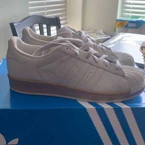 Adidas Shell toe with a gold lining